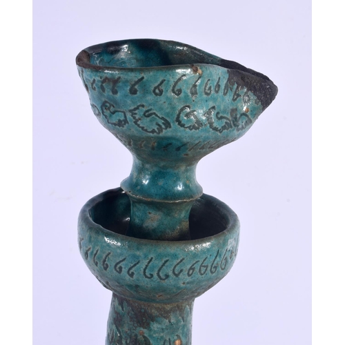 403 - A LARGE 17TH/18TH CENTURY PERSIAN TURQUOISE GLAZED OIL LAMP engraved with foliage and motifs. 38 cm ... 