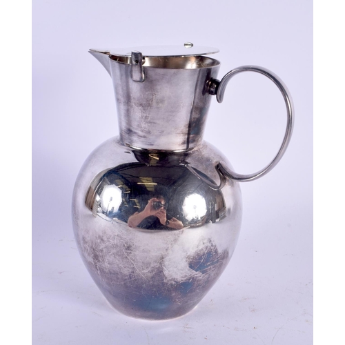 404 - AN ARTS AND CRAFTS WMF SILVER PLATED WATER JUG. 21 cm high.