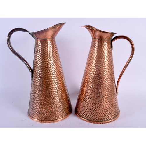 418 - A PAIR OF  ART NOUVEAU JOSEPH SANKEY & SON COPPER JUGS. 25.5 cm high.