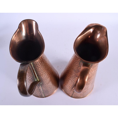 418 - A PAIR OF  ART NOUVEAU JOSEPH SANKEY & SON COPPER JUGS. 25.5 cm high.