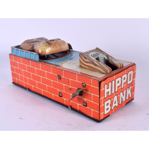 432 - A VINTAGE TIN PLATE WIND UP HIPPO MONEY BOX. 18 cm x 5 cm.