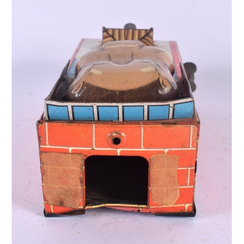 432 - A VINTAGE TIN PLATE WIND UP HIPPO MONEY BOX. 18 cm x 5 cm.