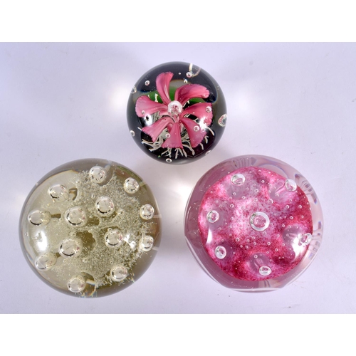 44 - THREE GLASS PAPERWEIGHTS. Largest 9.25 cm wide. (3)