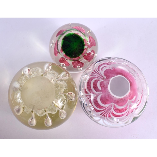 44 - THREE GLASS PAPERWEIGHTS. Largest 9.25 cm wide. (3)