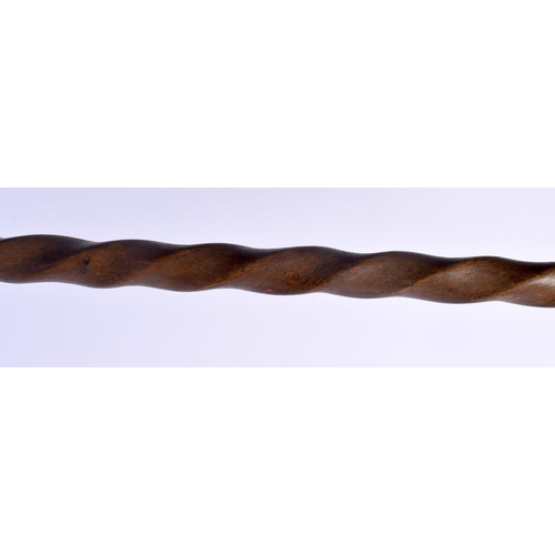 447 - AN 18TH/19TH CENTURY EUROPEAN CARVED FOLK ART WOOD WALKING CANE with spiral twist shaft. 86 cm long.