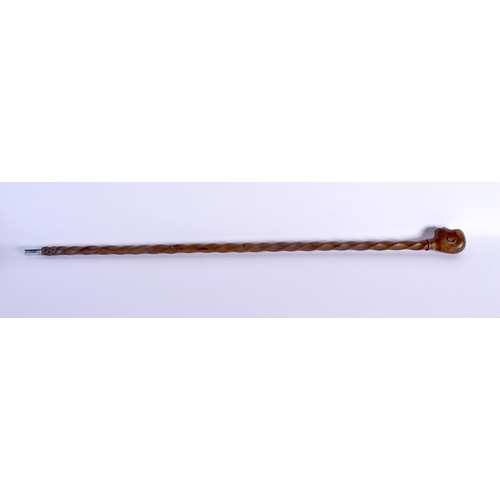 447 - AN 18TH/19TH CENTURY EUROPEAN CARVED FOLK ART WOOD WALKING CANE with spiral twist shaft. 86 cm long.