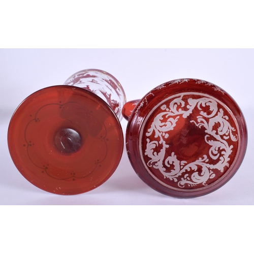 45 - A LARGE BOHEMIAN RUBY GLASS JUG together with a similar chalice Largest 25 cm high. (2)