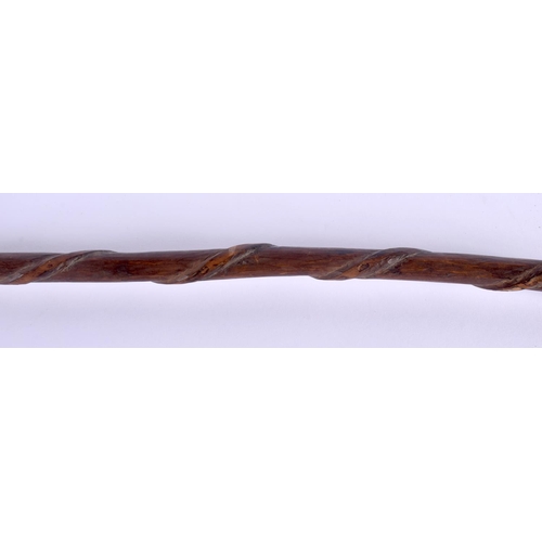 462 - A VINTAGE FOLK ART CARVED WOOD CANE. 78 cm long.