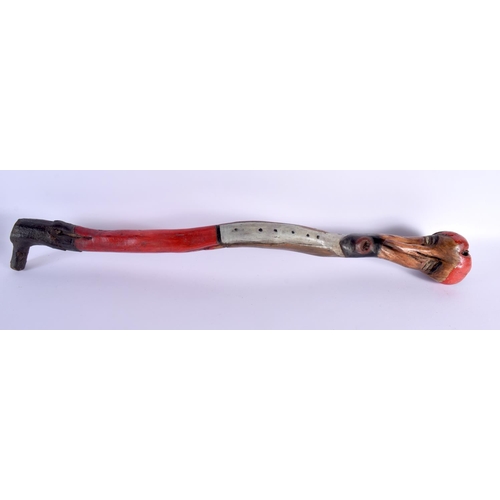 466 - A RARE ANTIQUE FOLK ART DOUBLE HEAD WALKING CANE. 86 cm long.