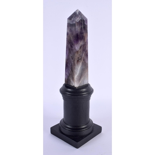 471 - AN AMETHYST OBELISK. 22 cm high.