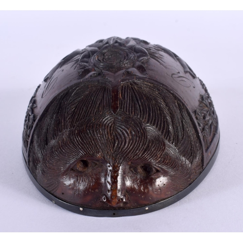 481 - AN 18TH CENTURY CONTINENTAL CARVED COCONUT CUP BUG BEAR with silver mounts. 13 cm x 8 cm.