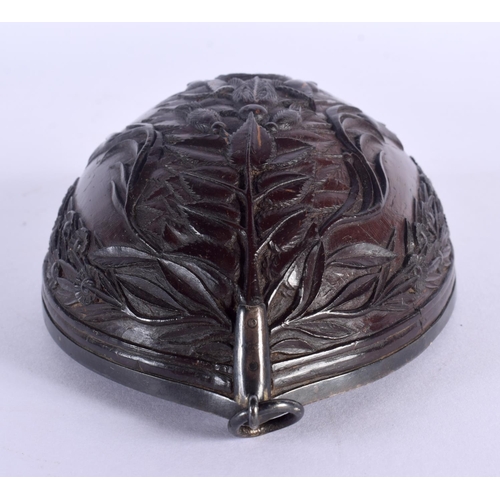 481 - AN 18TH CENTURY CONTINENTAL CARVED COCONUT CUP BUG BEAR with silver mounts. 13 cm x 8 cm.