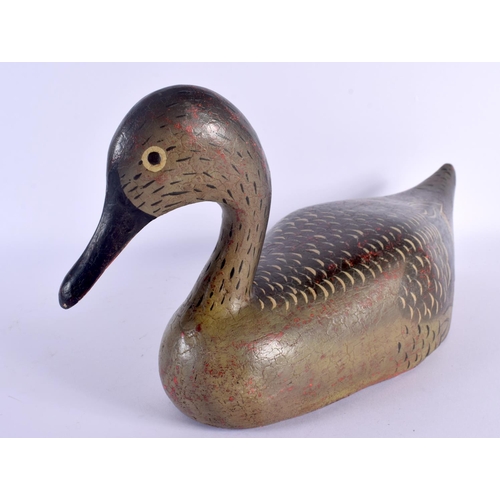 487 - A VINTAGE FOLK ART POLYCHROMED WOOD DECOY DUCK. 36 cm x 18 cm.