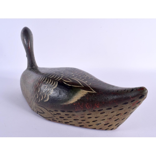 487 - A VINTAGE FOLK ART POLYCHROMED WOOD DECOY DUCK. 36 cm x 18 cm.