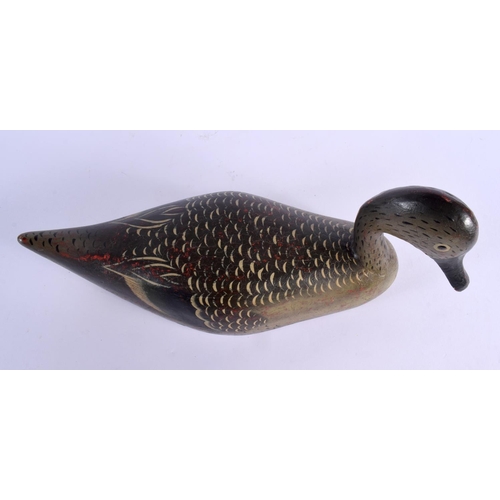 487 - A VINTAGE FOLK ART POLYCHROMED WOOD DECOY DUCK. 36 cm x 18 cm.