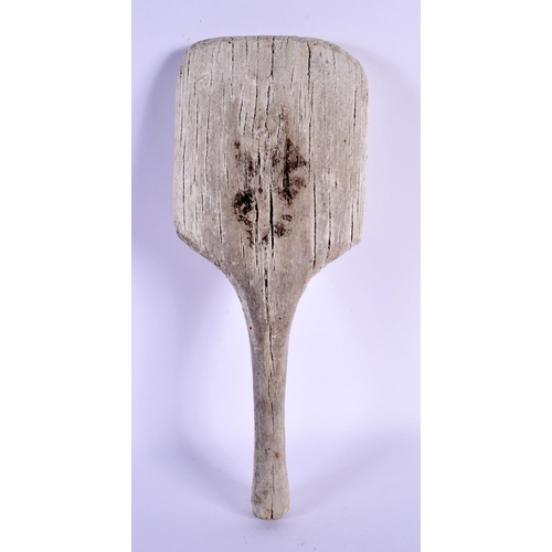 490 - A VINTAGE FOLK ART TRIBAL WOOD PADDLE. 30 cm x 12 cm.