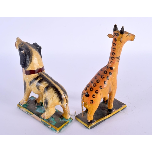 492 - A PAIR OF VINTAGE FOLK ART PAINTED WOOD ANIMALS. Largest 13 cm x 8 cm.