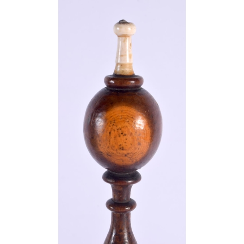 497 - A GEORGE III YEW WOOD LIGNUM VITAE BONE BOBBIN HOLDER. 42 cm x 10 cm.