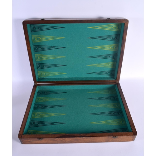 498 - AN ANTIQUE BACKGAMMON AND DRAUGHTS FOLDING GAMING BOARD. 56 cm x 70 cm open.