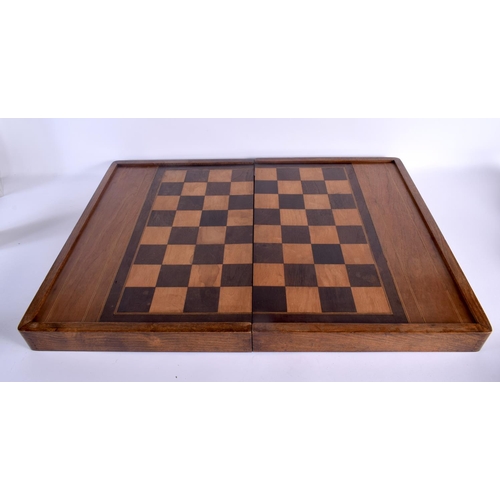 498 - AN ANTIQUE BACKGAMMON AND DRAUGHTS FOLDING GAMING BOARD. 56 cm x 70 cm open.