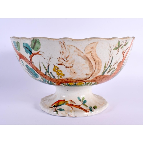 5 - A LARGE AND UNUSUAL VICTORIAN POTTERY PEDESTAL BOWL printed with squirrels. 22 cm x 14 cm.