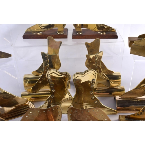 509 - A COLLECTION OF VINTAGE FOLK ART BRASS SHOP DISPLAY SHOES. Largest 12 cm x 18 cm. (qty)|