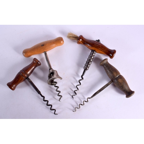 529 - FOUR ANTIQUE CORKSCREWS with wood handles. Largest 12 cm x 9 cm. (4)