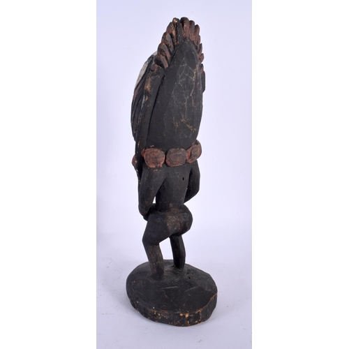 555 - A VINTAGE PAPUA NEW GUINEA CARVED WOOD FIGURE. 33 cm high.