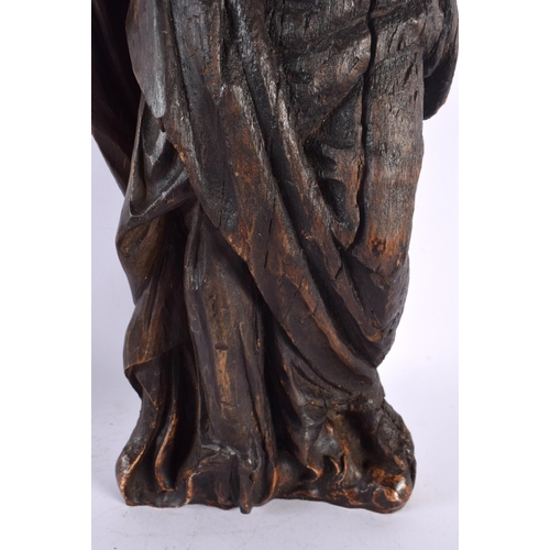 556 - A LARGE ANTIQUE CARVED EUROPEAN CARVED WOOD FIGURE OF A SAINT. 45 cm x 8 cm.