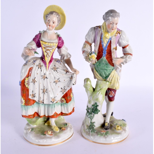 56 - A PAIR OF GERMAN PORCELAIN FIGURES. 23 cm high.