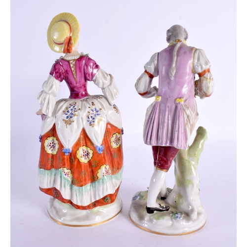 56 - A PAIR OF GERMAN PORCELAIN FIGURES. 23 cm high.