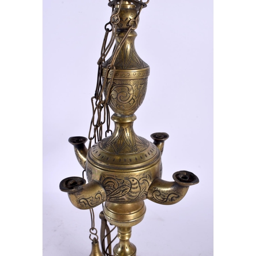 560 - A 19TH CENTURY INDIAN MIDDLE EASTERN HOLY OIL LAMP. 52 cm high.