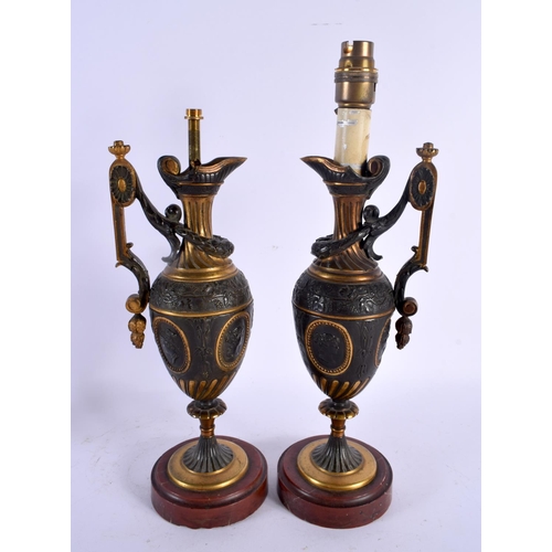 561 - A PAIR OF 19TH CENTURY EUROPEAN GRAND TOUR COUNTRY HOUSE BRONZE LAMPS formed as ewers. 39 cm high.