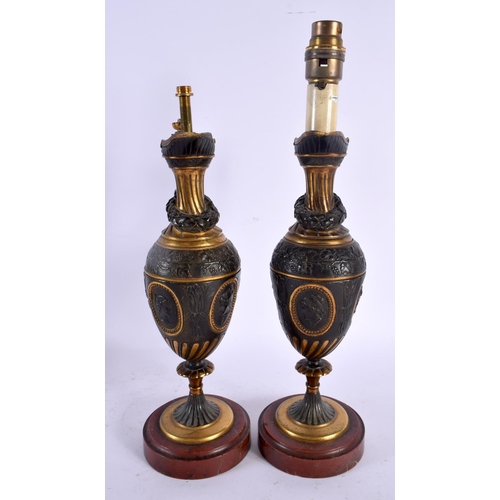 561 - A PAIR OF 19TH CENTURY EUROPEAN GRAND TOUR COUNTRY HOUSE BRONZE LAMPS formed as ewers. 39 cm high.