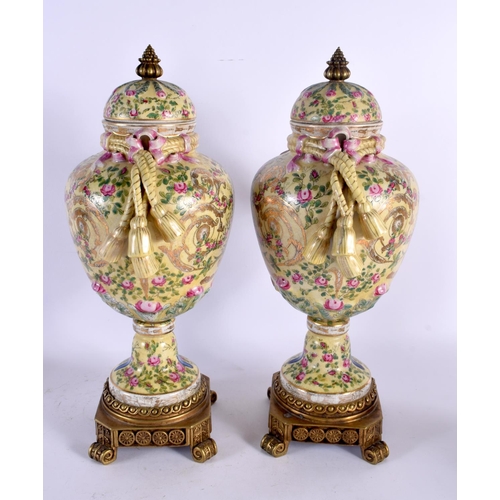 575 - A PAIR OF CONTEMPORARY COUNTRY HOUSE BRONZE AND PORCELAIN VASES. 44 cm high.