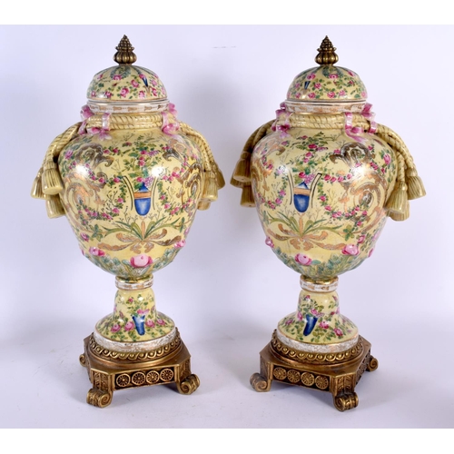 575 - A PAIR OF CONTEMPORARY COUNTRY HOUSE BRONZE AND PORCELAIN VASES. 44 cm high.