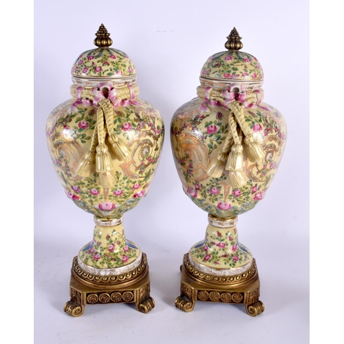 575 - A PAIR OF CONTEMPORARY COUNTRY HOUSE BRONZE AND PORCELAIN VASES. 44 cm high.