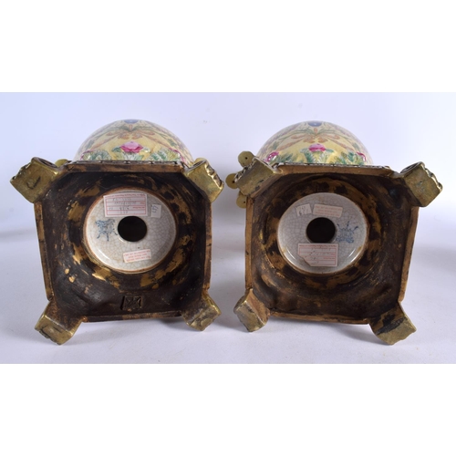 575 - A PAIR OF CONTEMPORARY COUNTRY HOUSE BRONZE AND PORCELAIN VASES. 44 cm high.