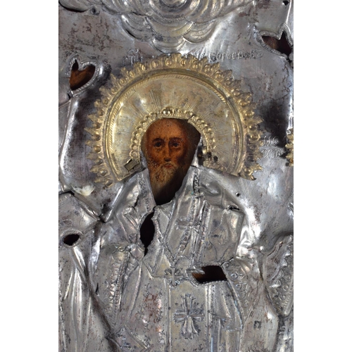 579 - AN ANTIQUE RUSSIAN ICON. 30 cm x 28 cm.