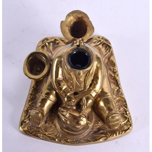 594 - A 1920S EUROPEAN BRASS INKWELL modelled as famous Surrey legend John Nicholson. 15 cm x 13 cm.