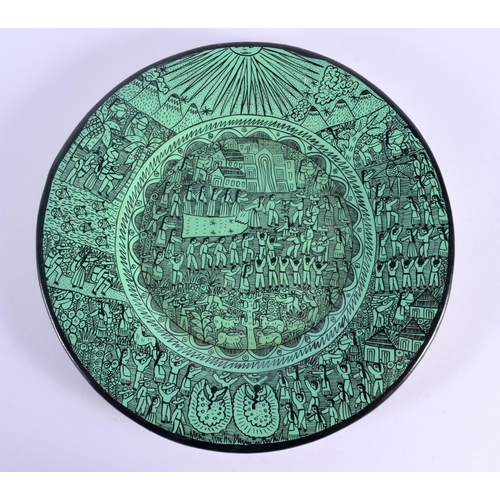 6 - A LARGE SOUTH AMERICAN GREEN PAINTED POTTERY DISH decorated with figures in various pursuits. 31 cm ... 