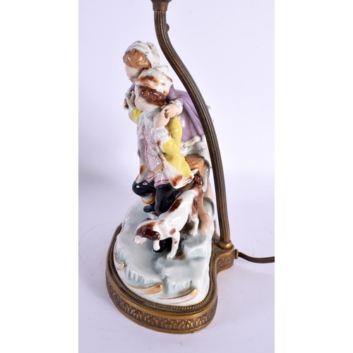 61 - A CONTINENTAL PORCELAIN FIGURAL LAMP. 44 cm high.