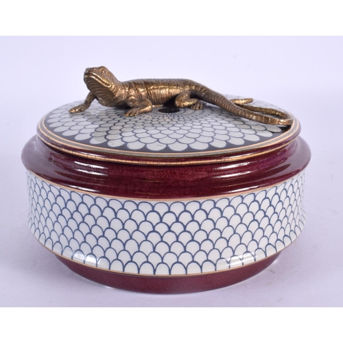 63 - A BRONZE AND POTTERY LIZARD BOX AND COVER. 12 cm wide.