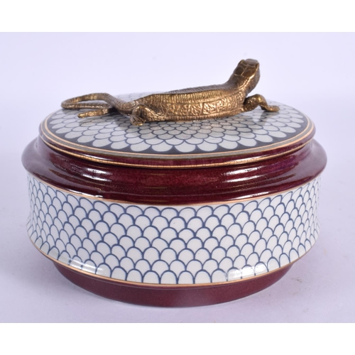 63 - A BRONZE AND POTTERY LIZARD BOX AND COVER. 12 cm wide.