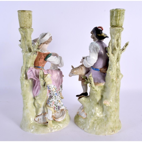 65 - A PAIR OF ANTIQUE PORCELAIN CANDLESTICKS. 27 cm high.