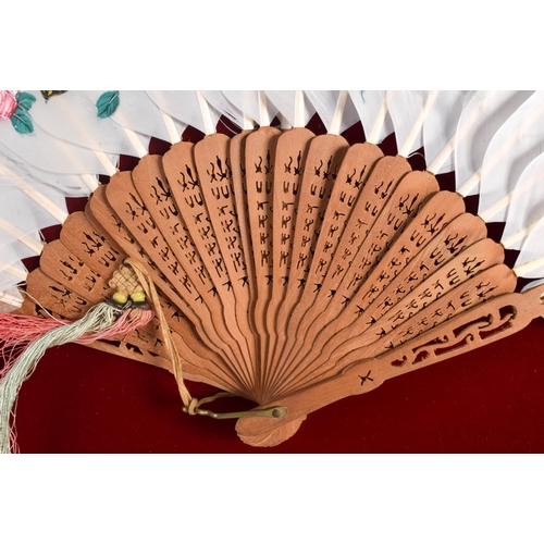 653 - A FRAMED 19TH CENTURY CHINESE KINGFISHER FEATHER FAN. 68 cm x 42 cm.