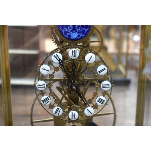 664 - A LARGE CONTEMPORARY ENAMELLED MOON PHASE SKELETON CLOCK. 54 cm x 28 cm.