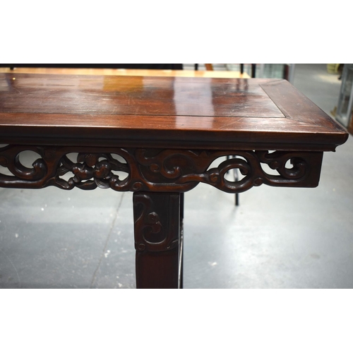 673 - A LARGE 19TH CENTURY CHINESE CARVED HARDWOOD ALTAR TABLE Qing. 210 cm x 105 cm x 48 cm.