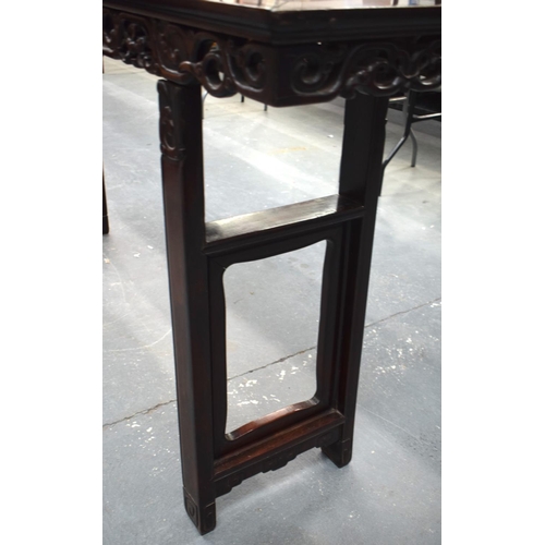 673 - A LARGE 19TH CENTURY CHINESE CARVED HARDWOOD ALTAR TABLE Qing. 210 cm x 105 cm x 48 cm.