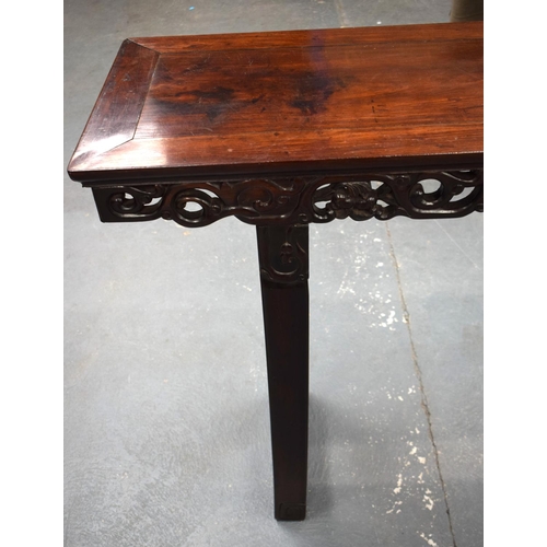 673 - A LARGE 19TH CENTURY CHINESE CARVED HARDWOOD ALTAR TABLE Qing. 210 cm x 105 cm x 48 cm.